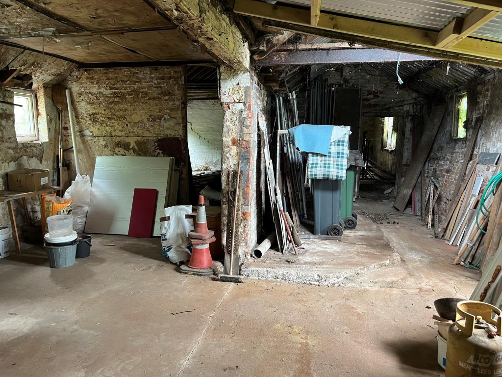 Lot: 76 - DOUBLE-FRONTED SHOP, FLAT LET TO A REGULATED TENANT AND FORMER BAKEHOUSE WITH POTENTIAL - Former Bakehouse at rear of Shop and Flat